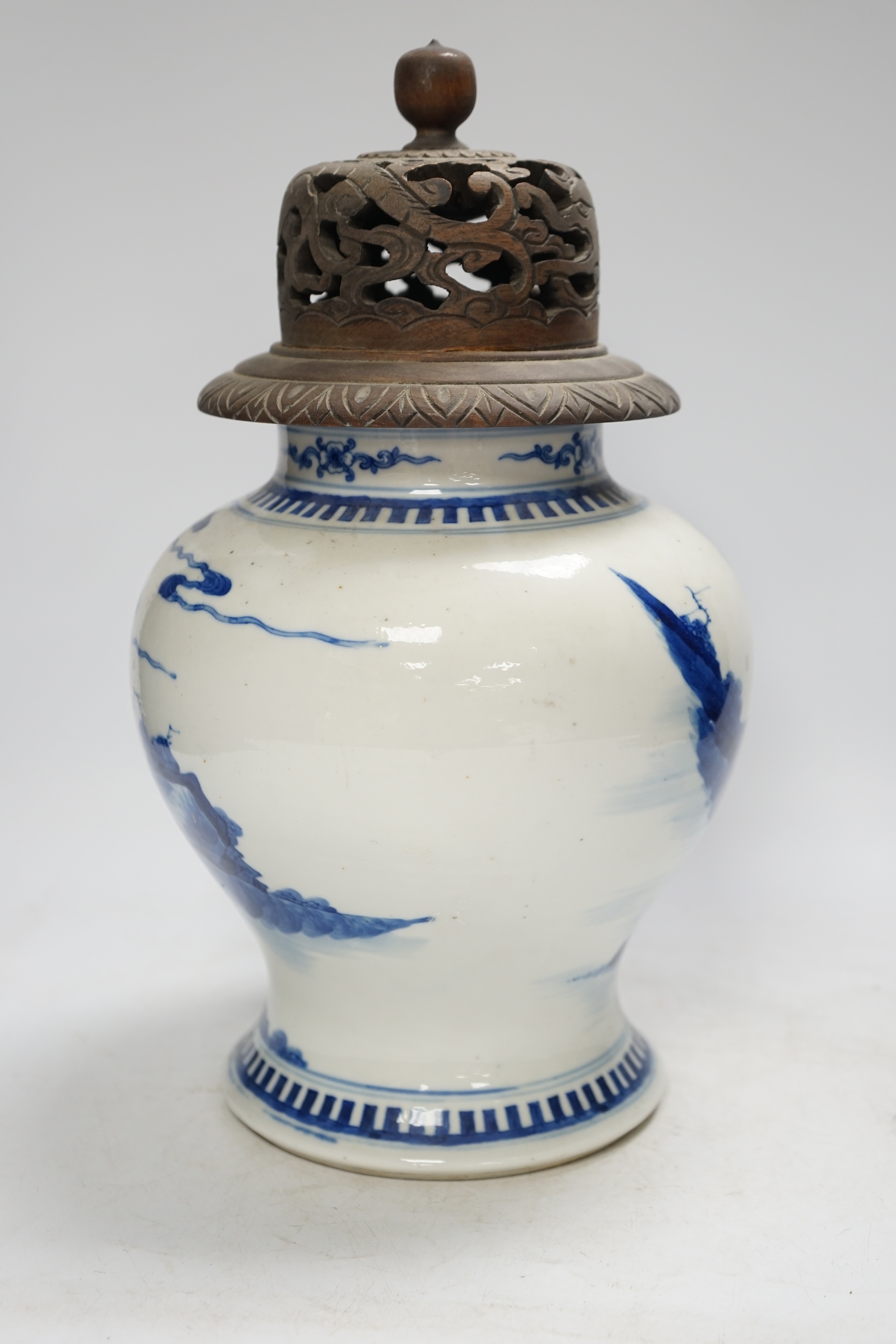 A 19th century Chinese blue and white baluster jar, painted with a scene from the Romance of the Western chamber, wood cover, 34cm. Condition - good